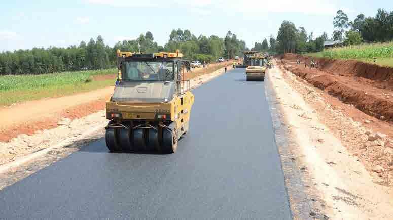 Road being paved through open country